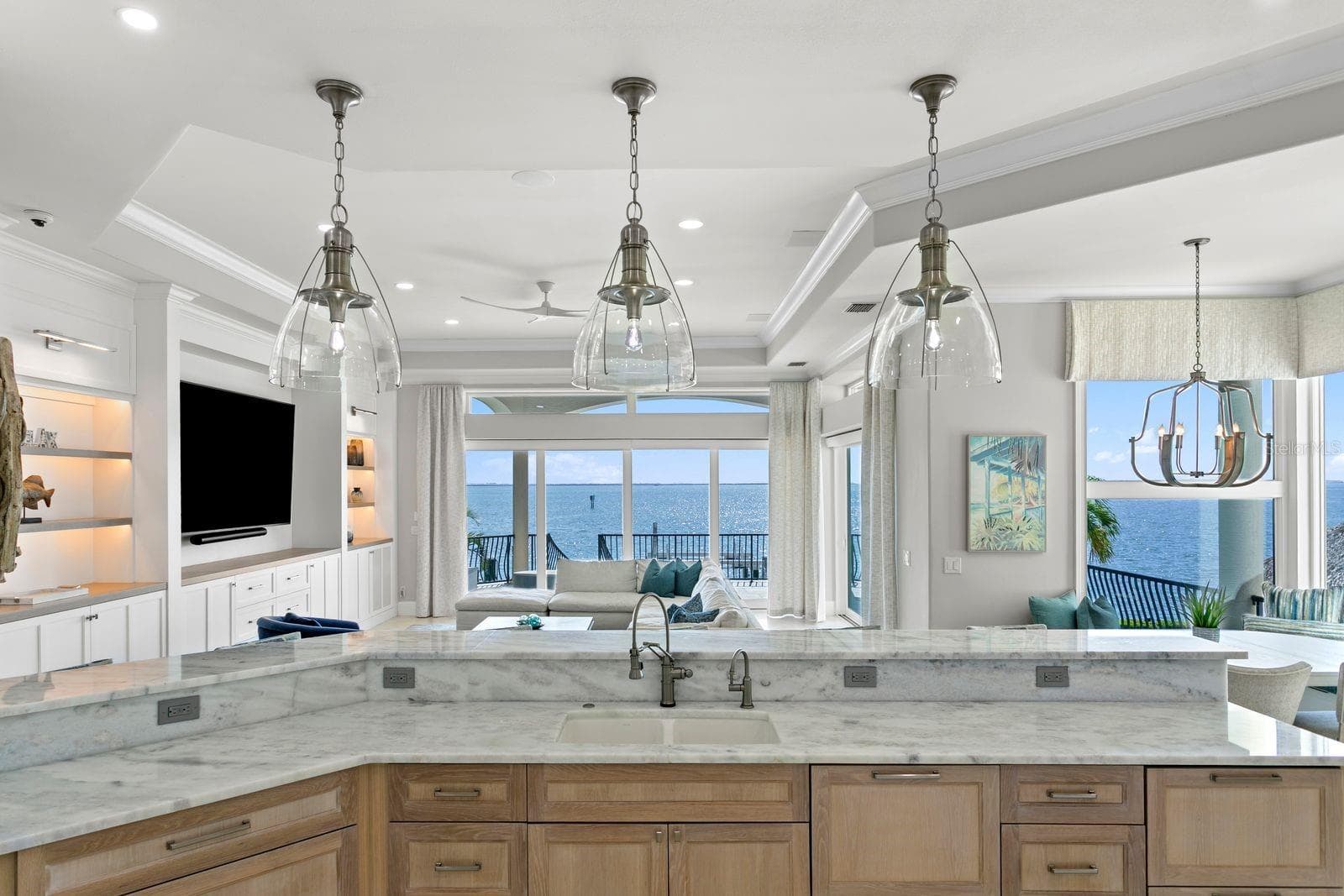Another breathtaking kitchen view overlooking the stunning waterfront landscape. - 611 1ST AVE S, TIERRA VERDE