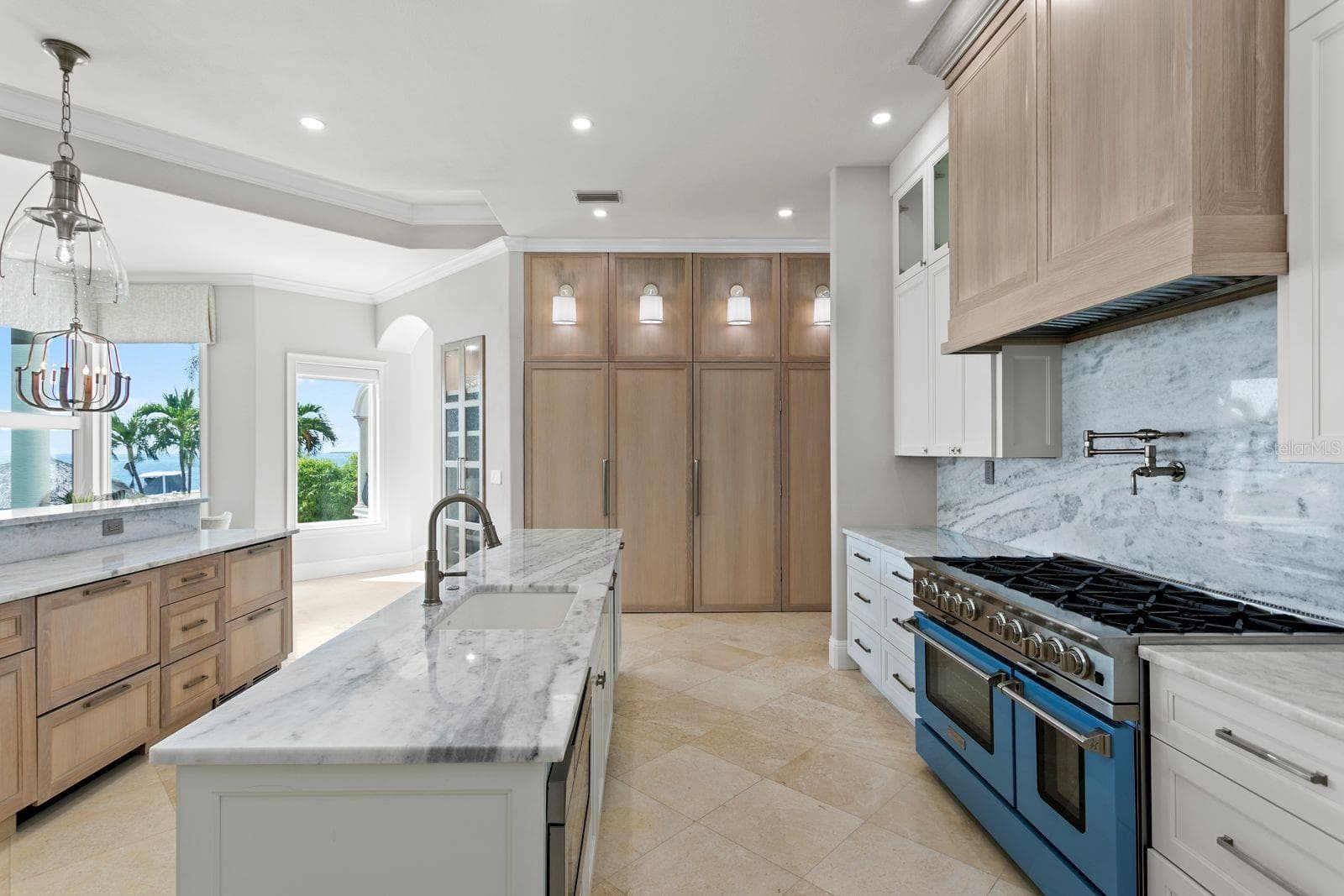 Beautiful Tampa Bay views can be enjoyed from every angle of this elegant kitchen. - 611 1ST AVE S, TIERRA VERDE