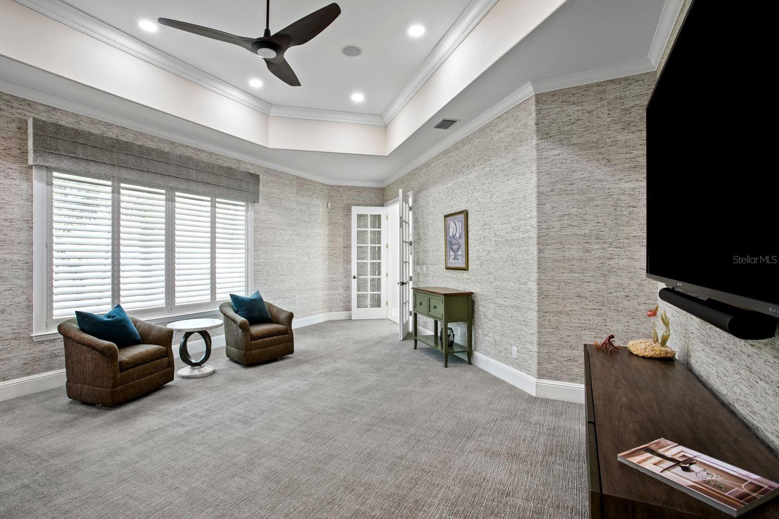A sophisticated social lounge complete with a built in bar and media area. - 611 1ST AVE S, TIERRA VERDE