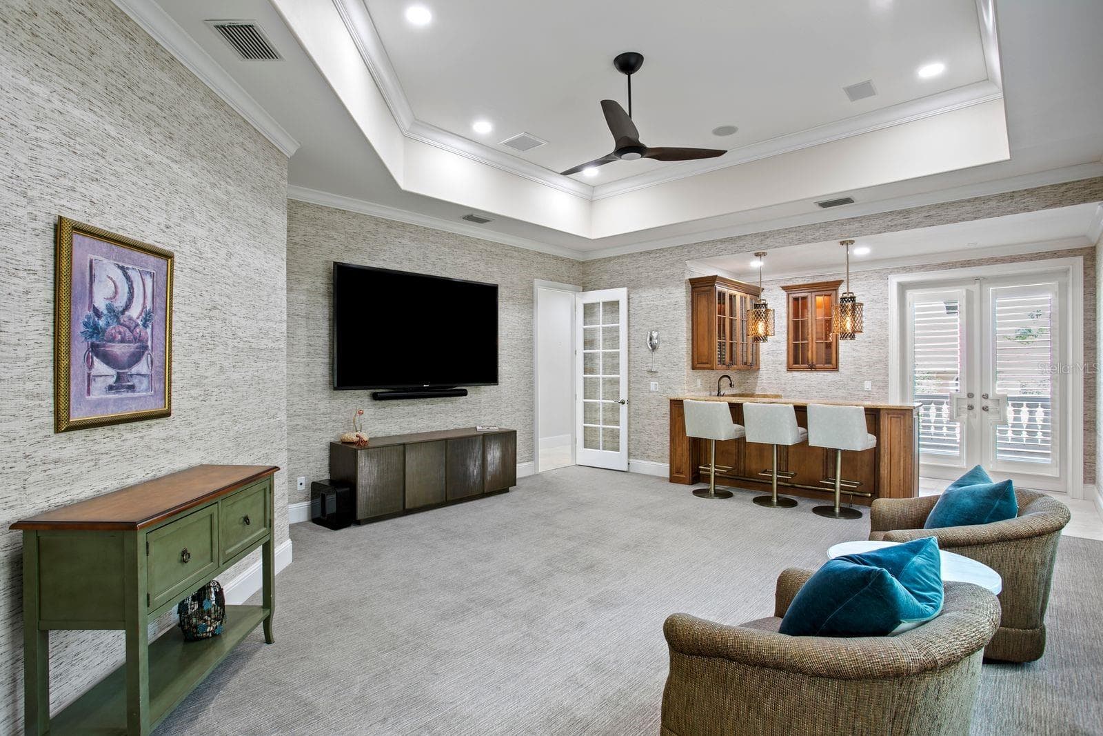 Elegant social lounge featuring a refinded bar. - 611 1ST AVE S, TIERRA VERDE