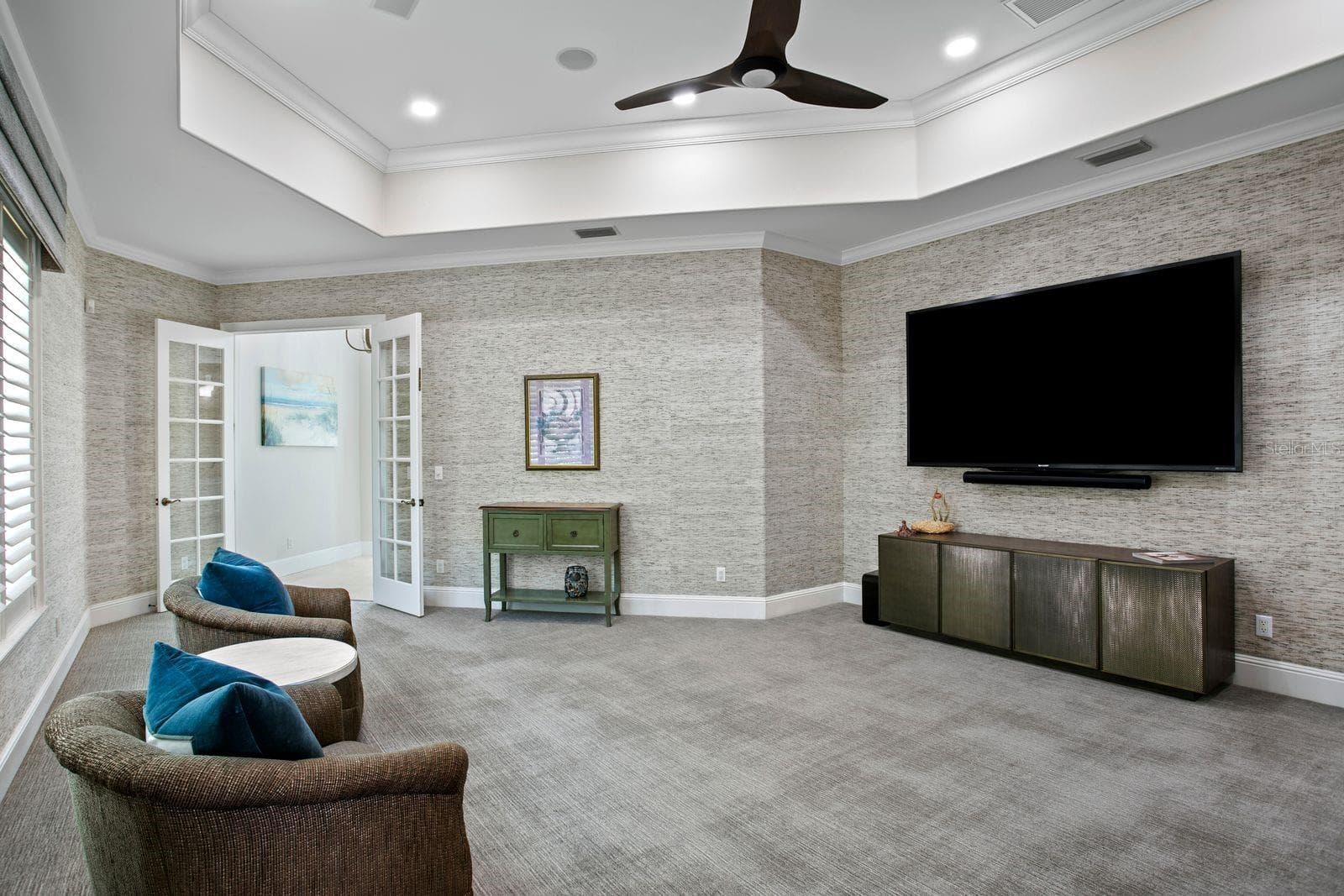 Another view of the social lounge, highlighted by plush luxury carpeting. - 611 1ST AVE S, TIERRA VERDE