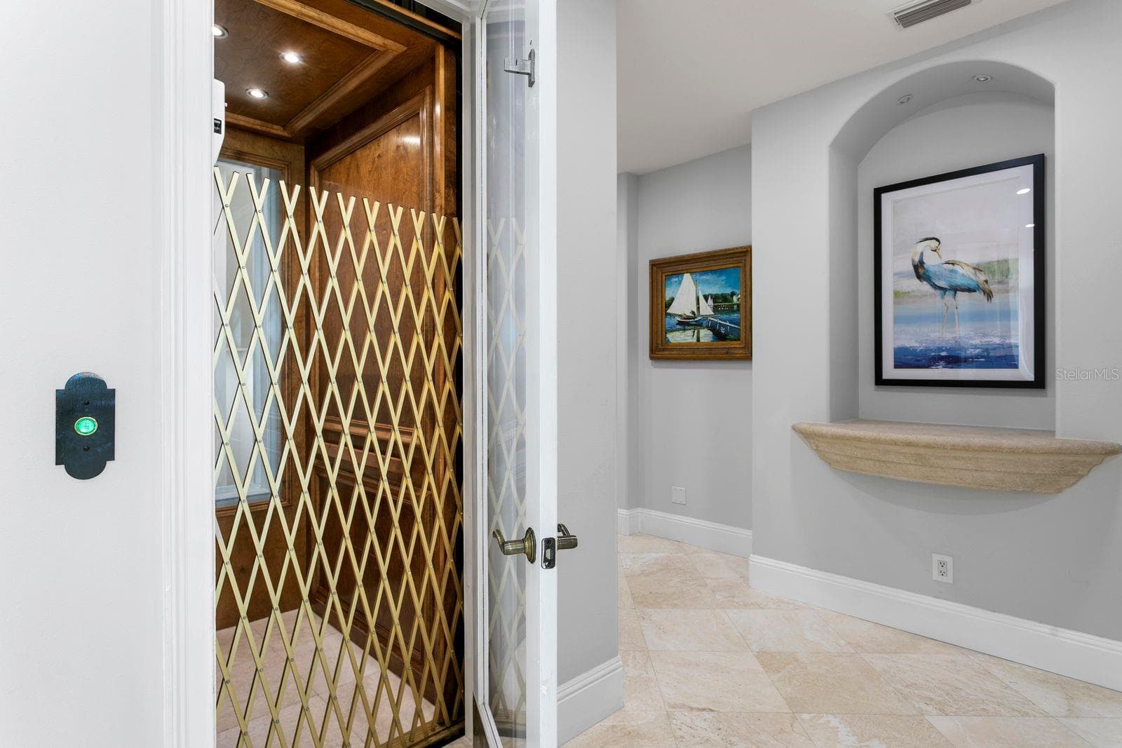 The residence is equipped with a private elevator for effortless access to all floors. - 611 1ST AVE S, TIERRA VERDE