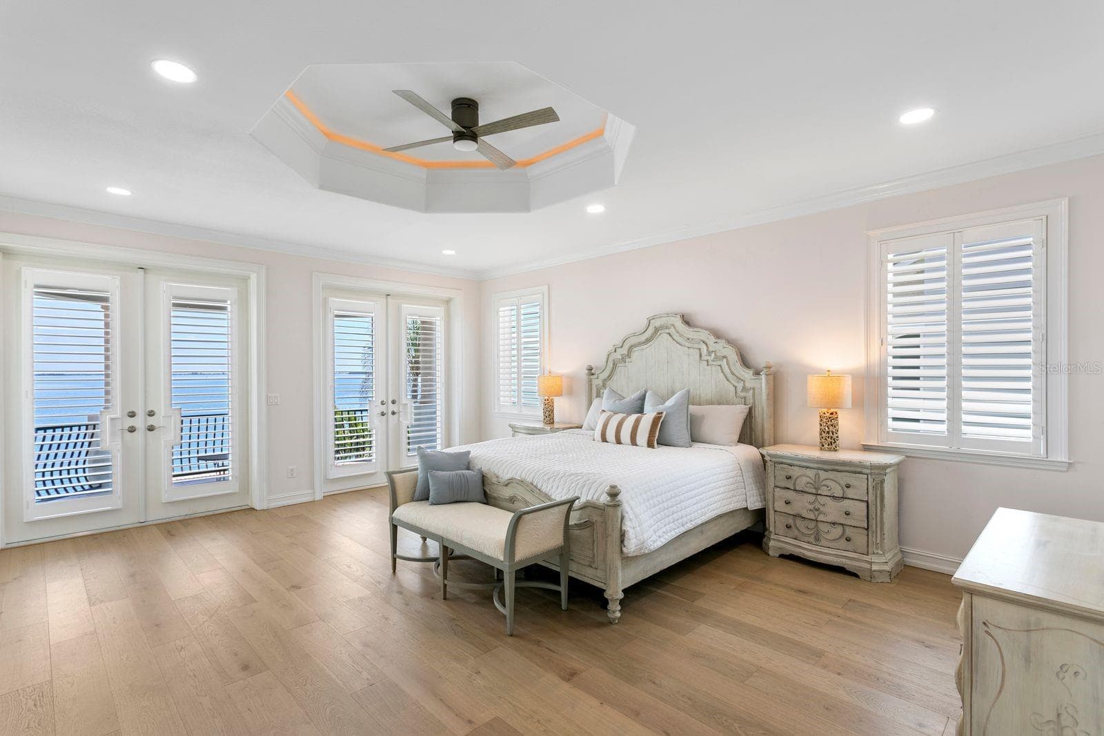 Top level primary suite with spacious balcony overlooking the sparkling waters of Tampa Bay. - 611 1ST AVE S, TIERRA VERDE