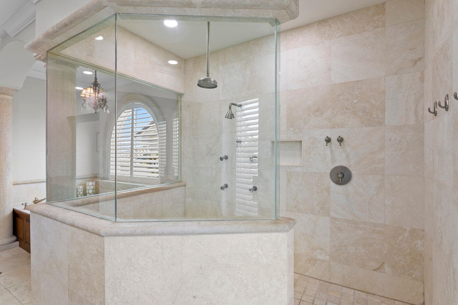 Top level primary ensuite with soaking tub and walk-in shower. - 611 1ST AVE S, TIERRA VERDE
