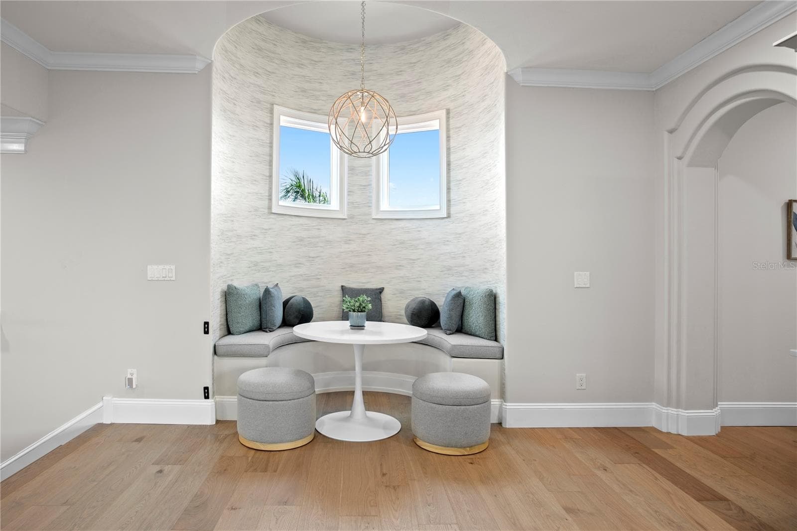 Flex space opens to the left wing, featuring a seating area and TV lounge. - 611 1ST AVE S, TIERRA VERDE