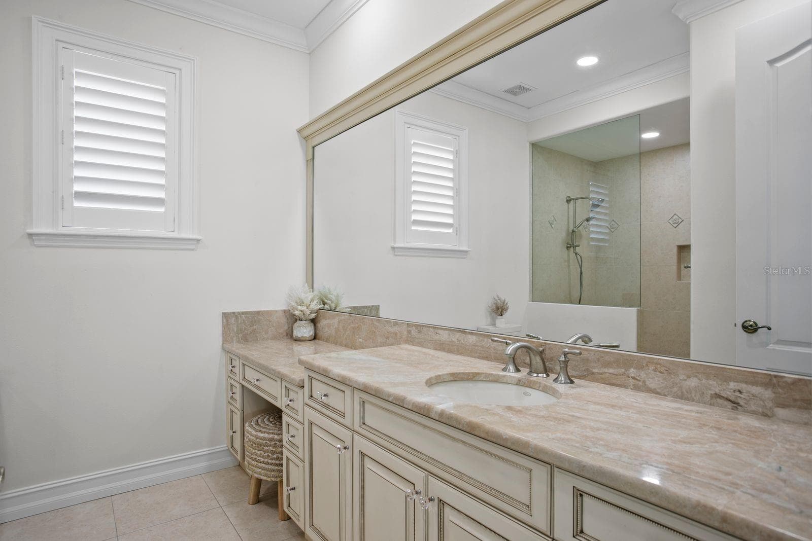 Top level bedroom two, ensuite with expanive vanity. - 611 1ST AVE S, TIERRA VERDE