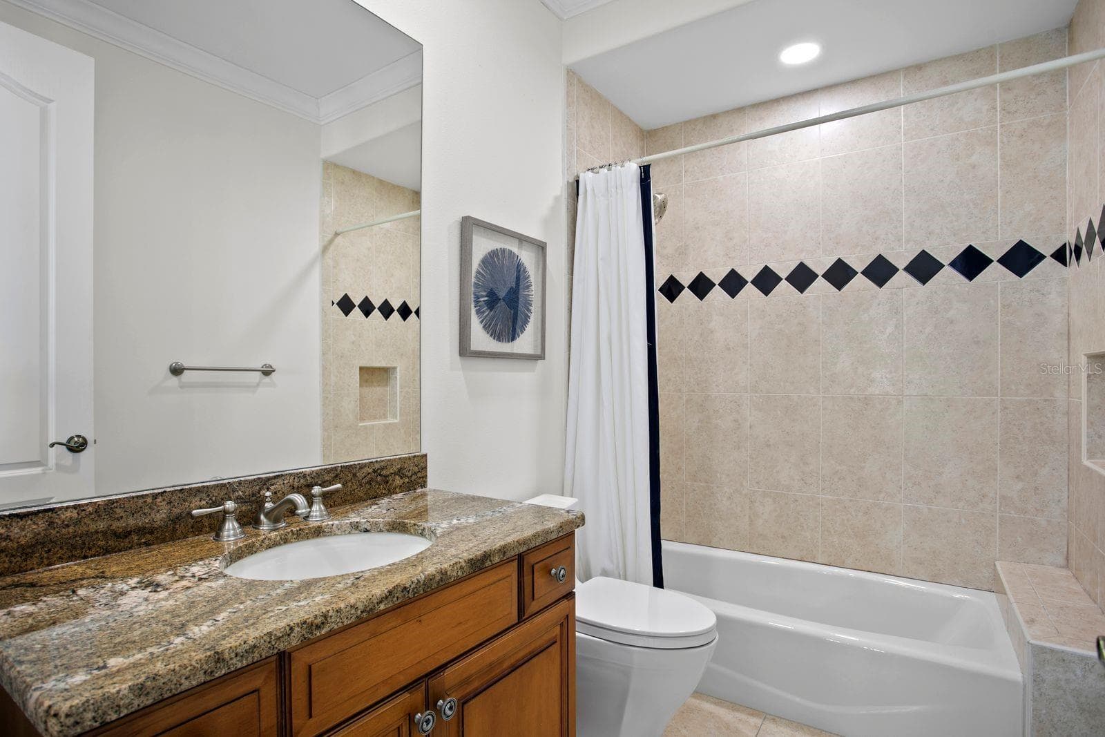 Top level bedroom three with a private ensuite. - 611 1ST AVE S, TIERRA VERDE