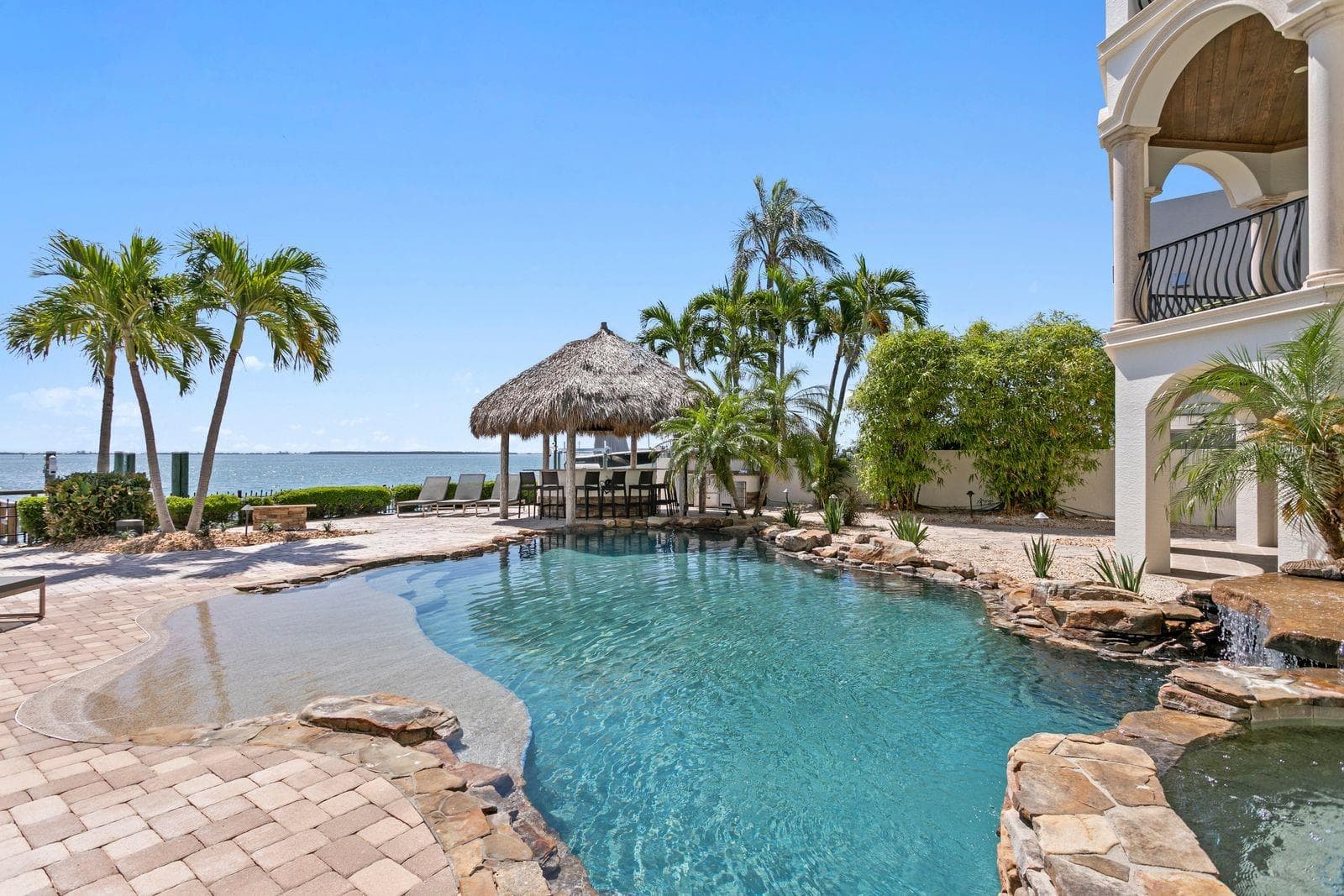 Lagoon style pool with spa and waterfall. - 611 1ST AVE S, TIERRA VERDE