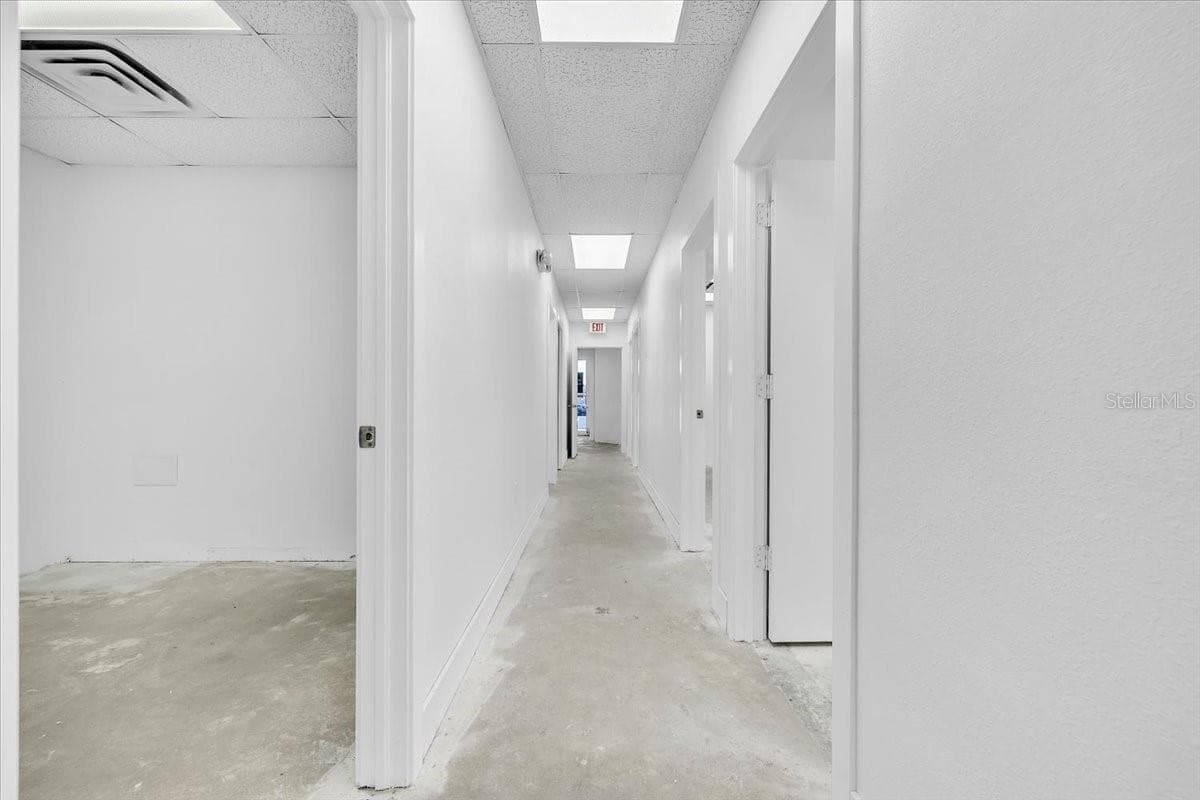 SUITE 102B Left Side Hallway Looking Towards Entrance - 3300 TAMIAMI TRL #2, PORT CHARLOTTE