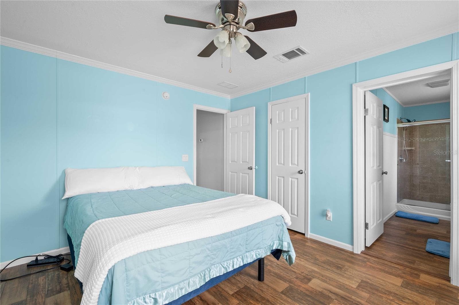 Primary bedroom has large walk-in closet. - 10042 COLLINGWOOD AVE, DADE CITY