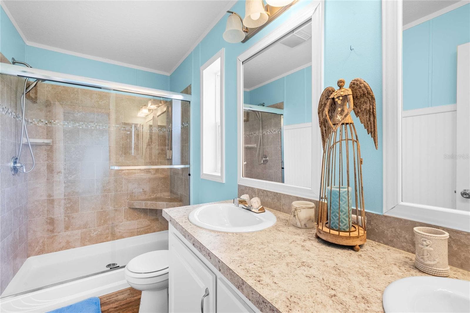 Incredible primary bathroom with custom step-in shower. - 10042 COLLINGWOOD AVE, DADE CITY