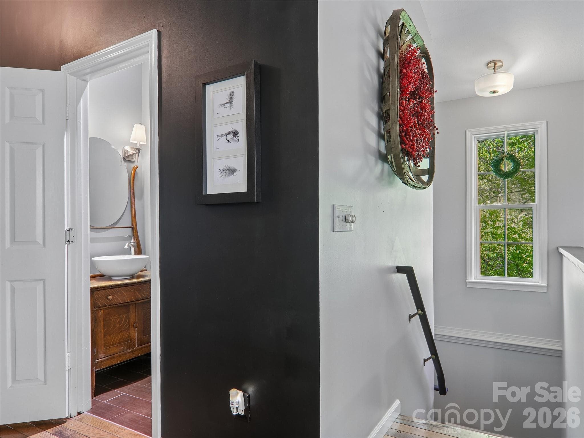 Half bath on main level;stairs lead to basement apartment w/private entrance - Pisgah Forest