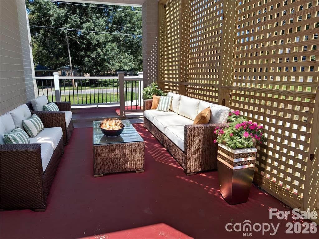 Virtually staged Front porch. with lattice for shade. - 933 W Warren Street, Shelby