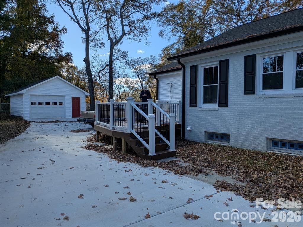 Steps to back deck that wraps around to back of house. - 933 W Warren Street, Shelby