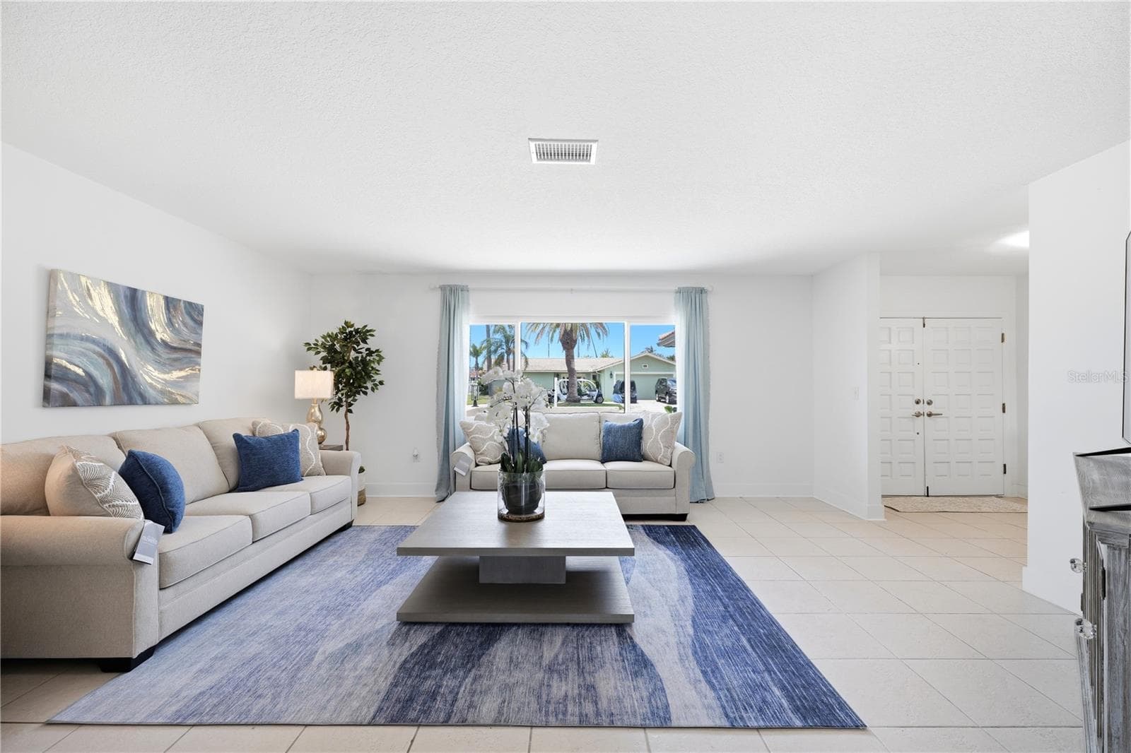 large picture window in living room brings in lots of natural light - 5016 DORY DR, NEW PORT RICHEY