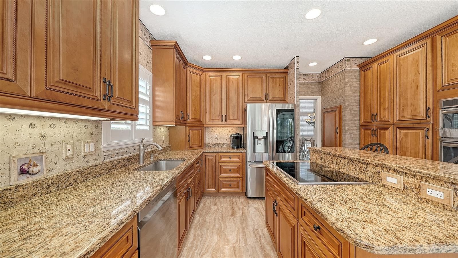 Perfect chef's kitchen with granite countertops and all Stainless appliance package featuring loads of storage! - 3040 GULF OF MEXICO DR #3, LONGBOAT KEY