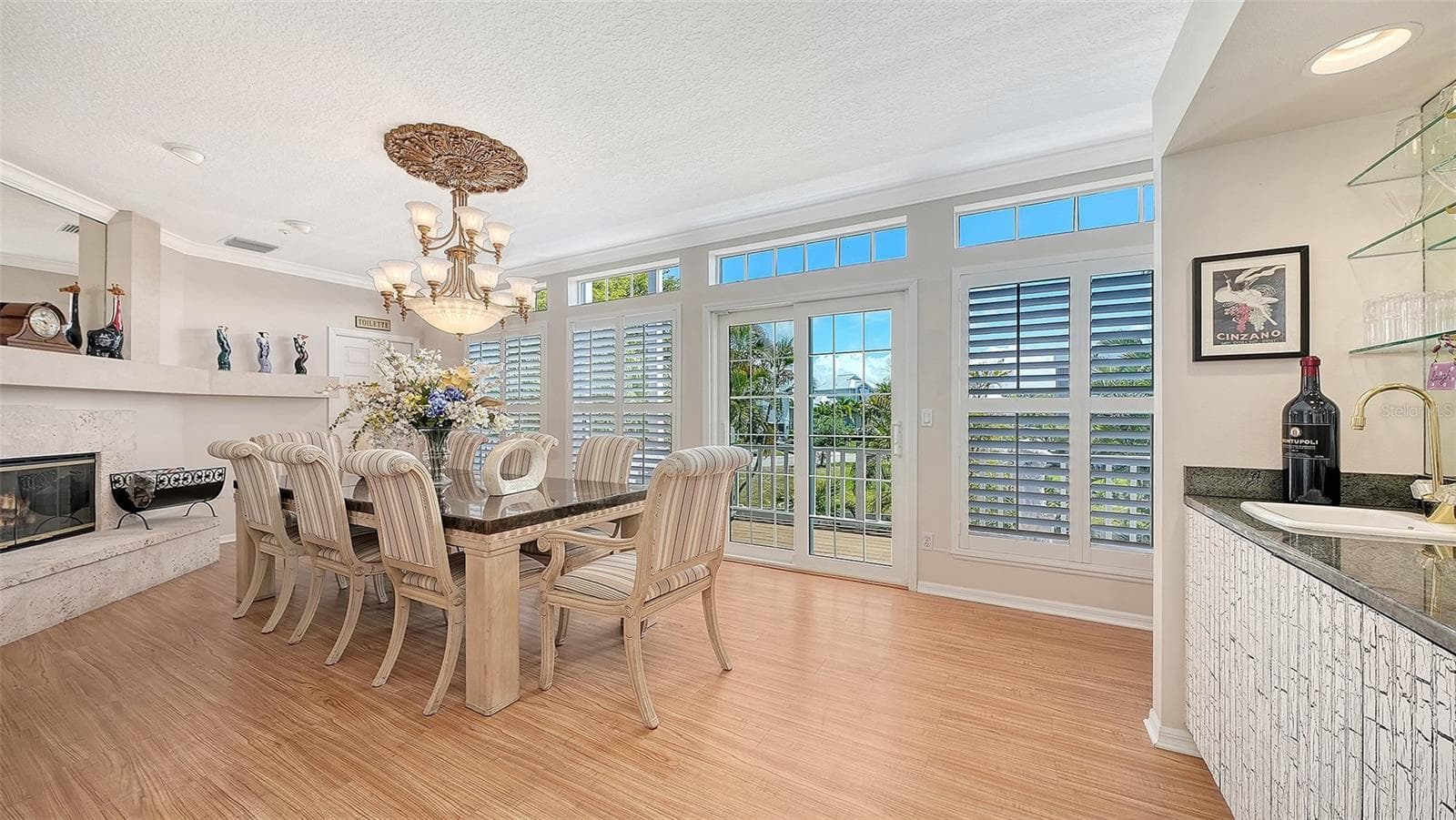 We all love a built-in mirrored wetbar with solid surface countertops and an electric fireplace to add ambience to your dinner hour! - 3040 GULF OF MEXICO DR #3, LONGBOAT KEY