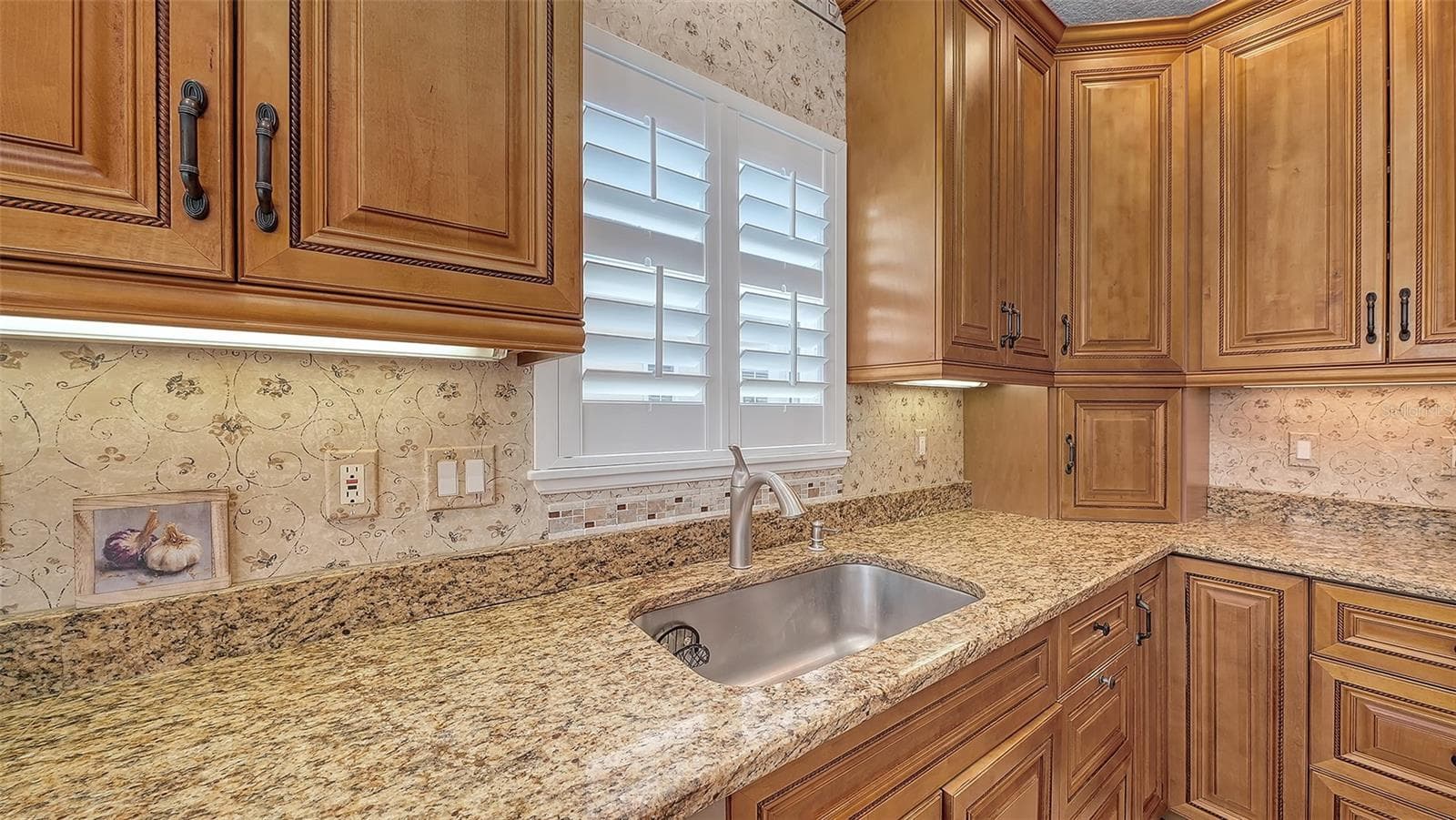 You will love food prep in this stunning dream kitchen with wood cabinets and appliance garage and lazy Susan and loads of deep drawers and storage! - 3040 GULF OF MEXICO DR #3, LONGBOAT KEY