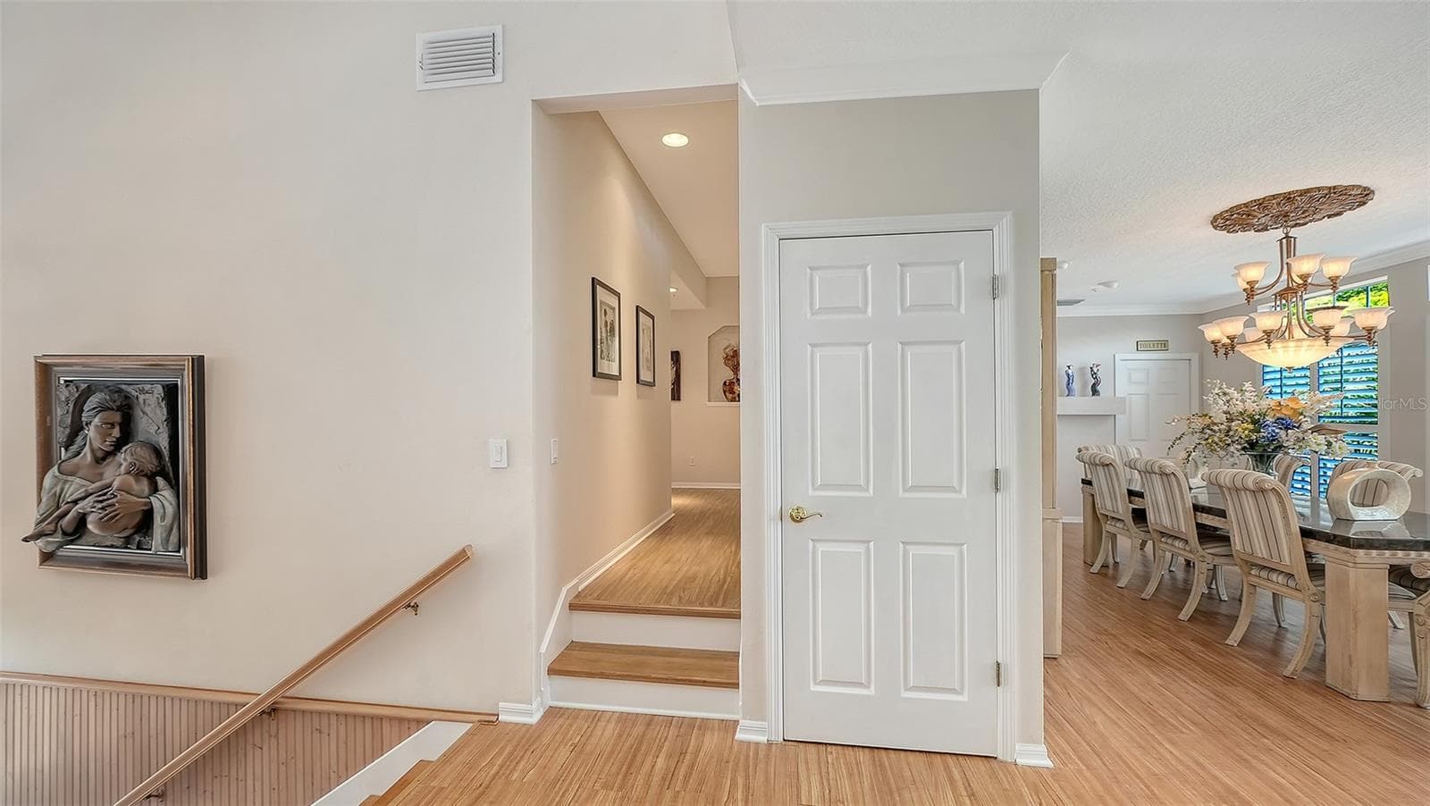 Two steps lead you from the main living level to the guest bedrooms. Entry door from lower stairwell leads up to main living level. - 3040 GULF OF MEXICO DR #3, LONGBOAT KEY