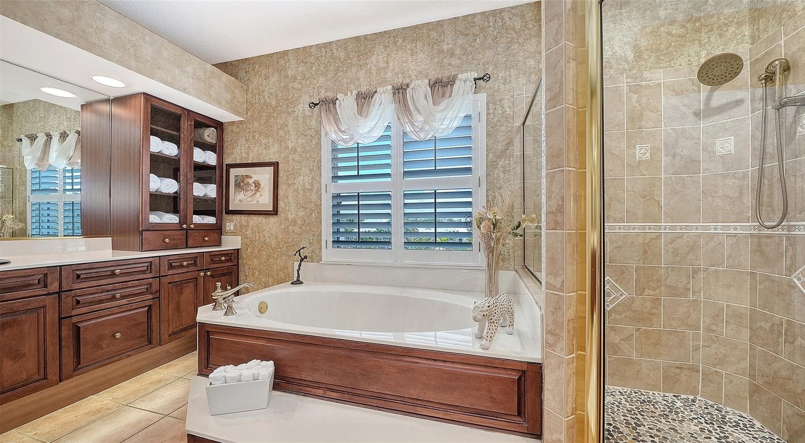 Relax in your private retreat in a generous soaking tub and separate shower with upgraded fixtures and specialty tiling details. - 3040 GULF OF MEXICO DR #3, LONGBOAT KEY
