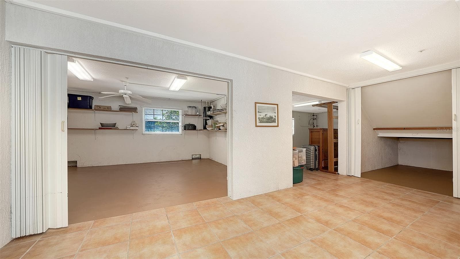 Spacious 1st level off the garage features tons of storage, perfect for fitness center, yoga, or beach toys, kayaks, bikes, etc. - 3040 GULF OF MEXICO DR #3, LONGBOAT KEY