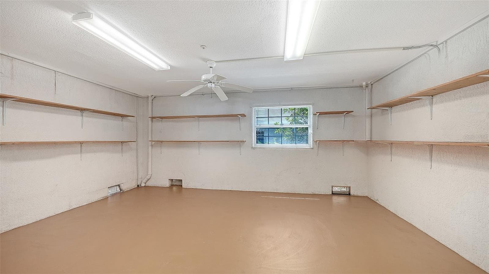 Spacious 1st level off the garage features tons of storage, perfect for fitness center, yoga, or beach toys, kayaks, bikes, etc. - 3040 GULF OF MEXICO DR #3, LONGBOAT KEY