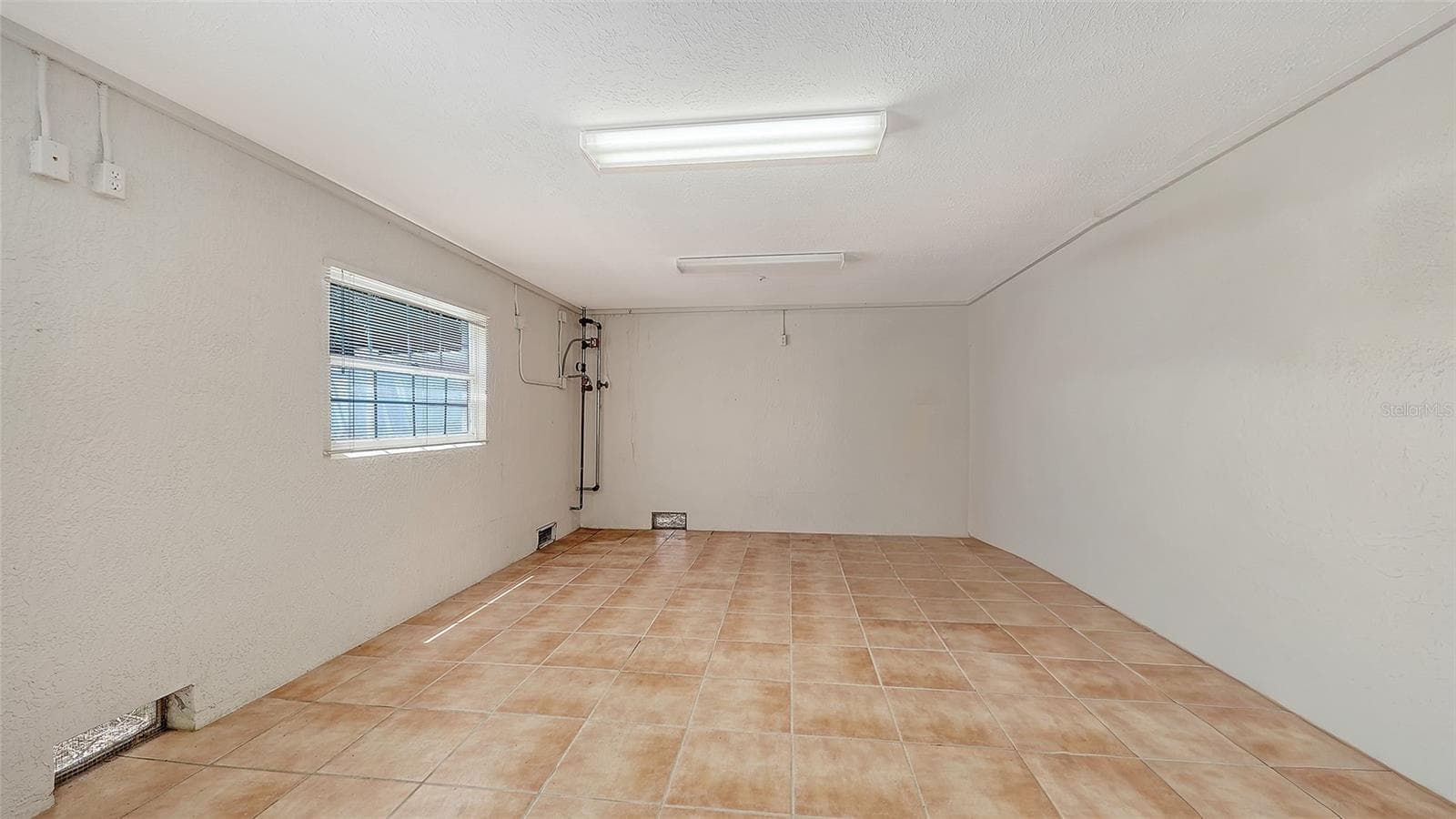 Spacious 1st level off the garage features tons of storage, perfect for fitness center, yoga, or beach toys, kayaks, bikes, etc. - 3040 GULF OF MEXICO DR #3, LONGBOAT KEY