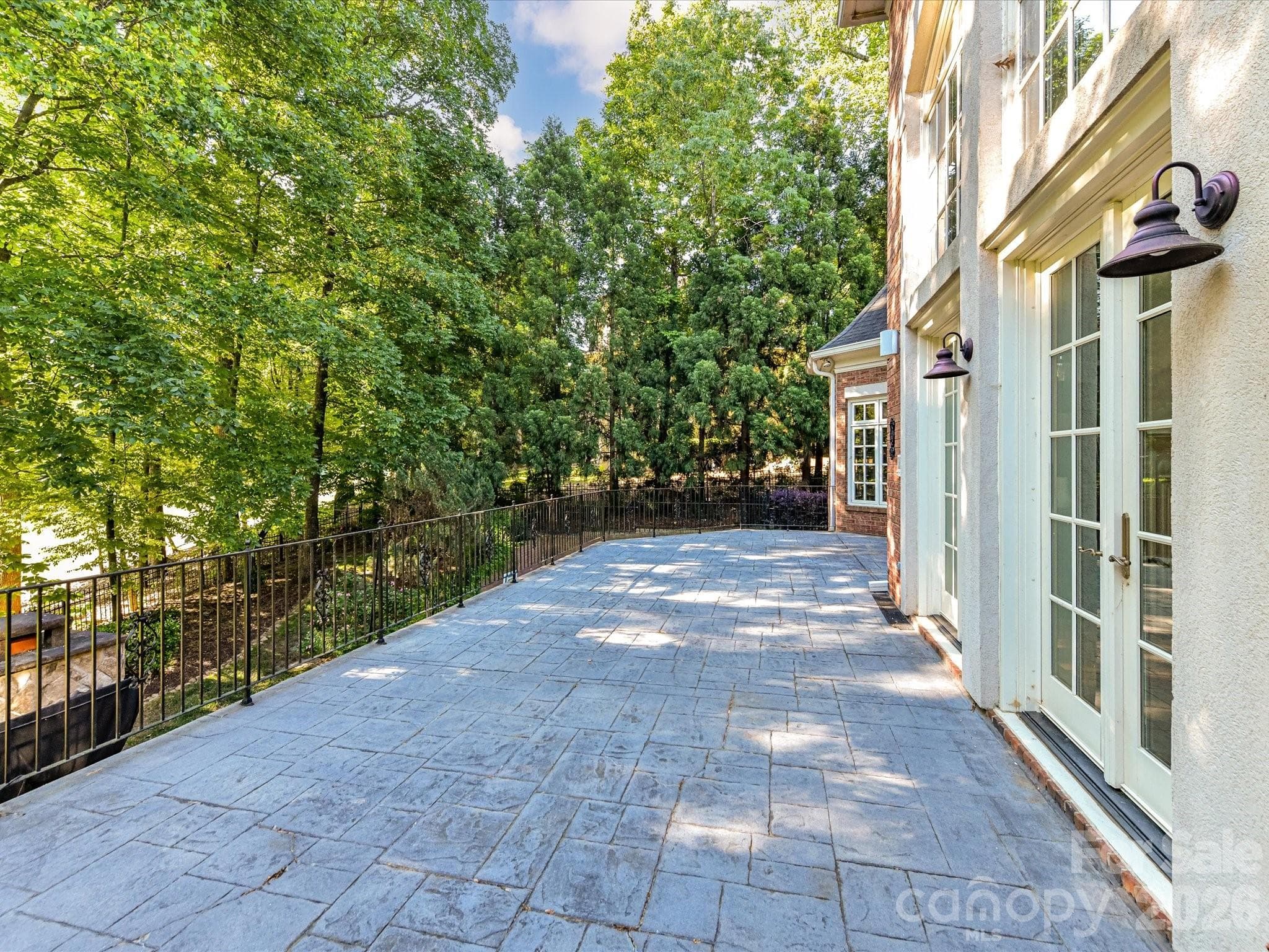 Upper terrace overlooking lower patio and golf course - Charlotte