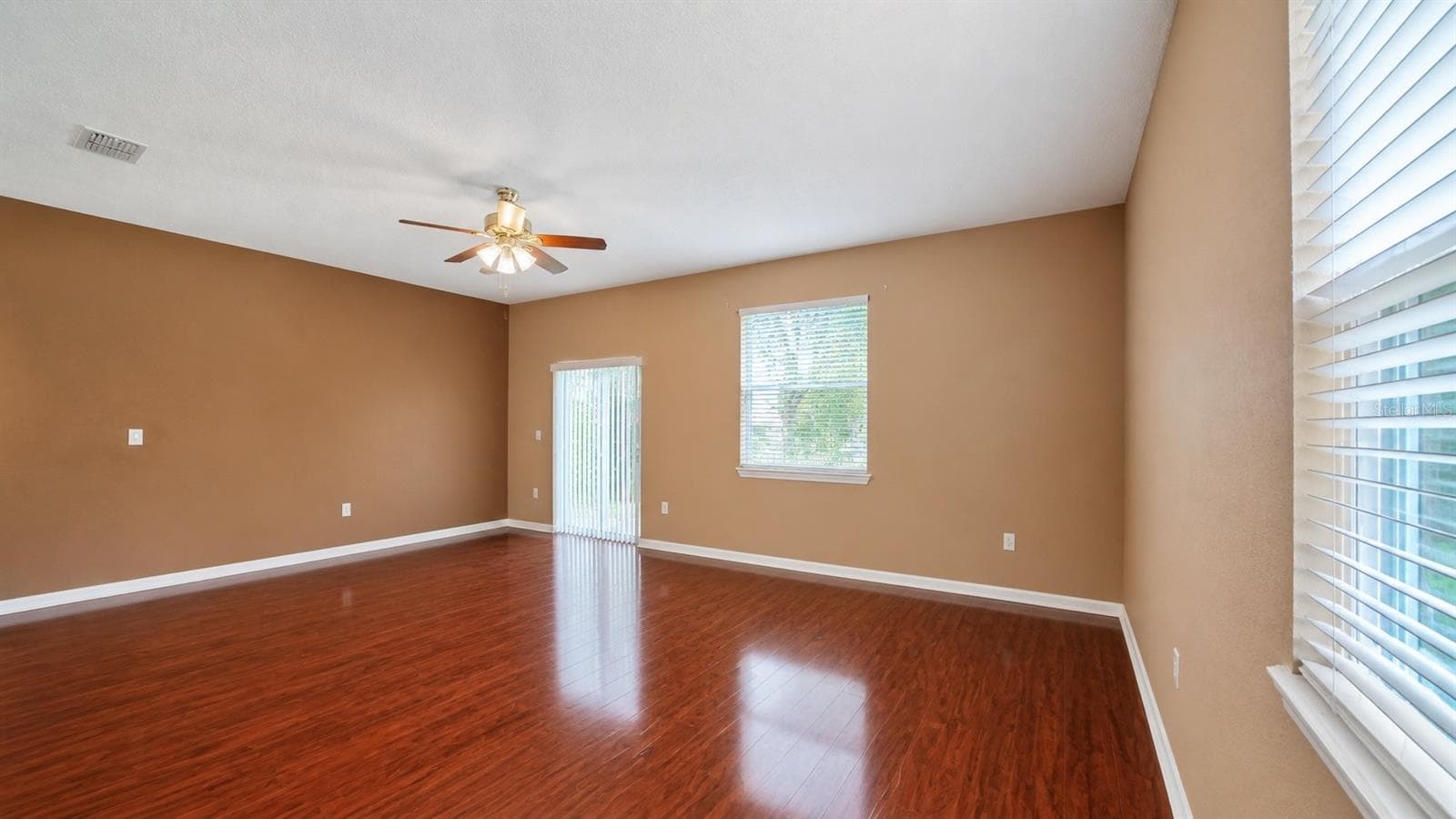 Living room is adjacent to the entry, kitchen and dining room. - 4116 ORANGE TREE CT, ST CLOUD