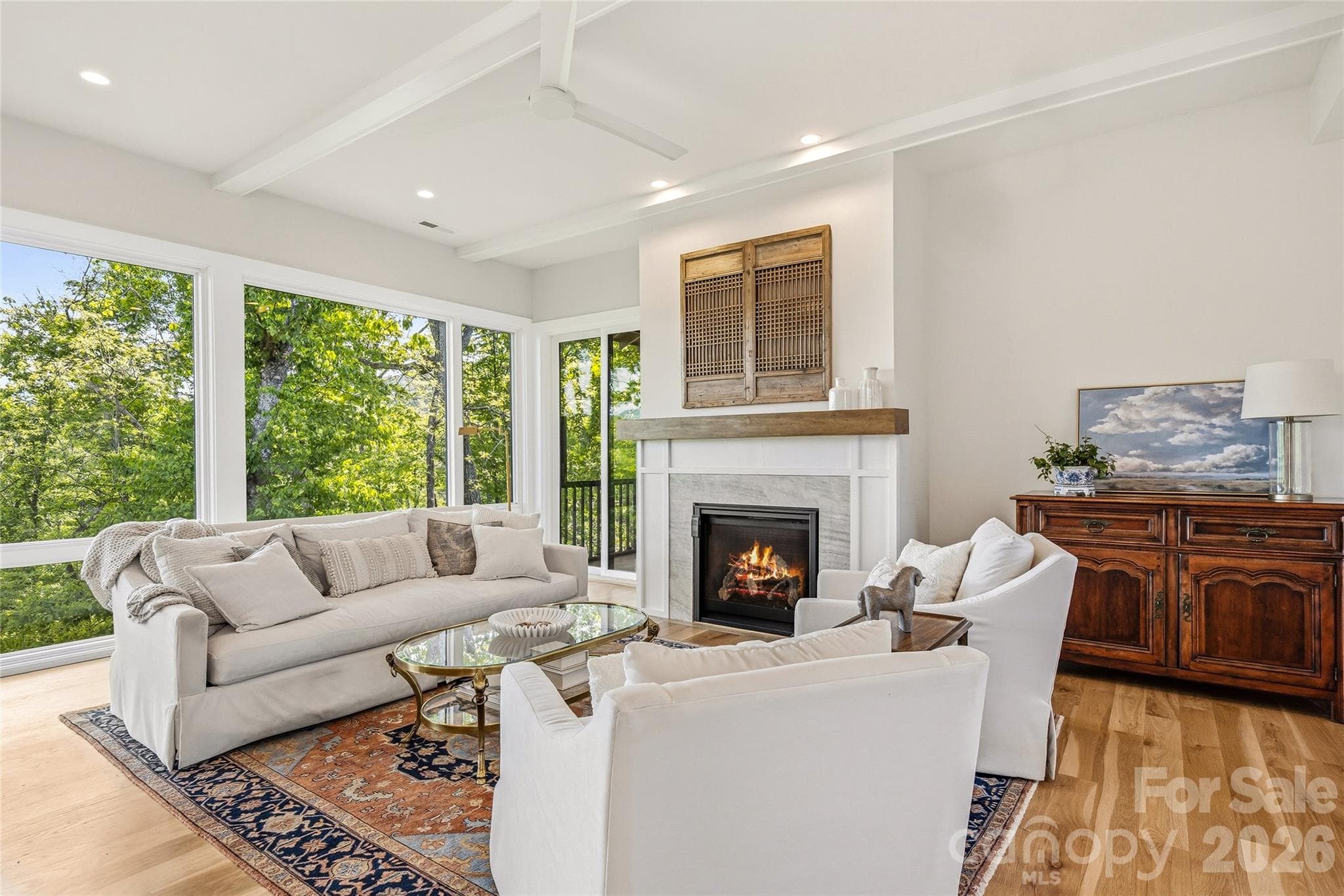 Gas fireplace and walls of windows. - Asheville