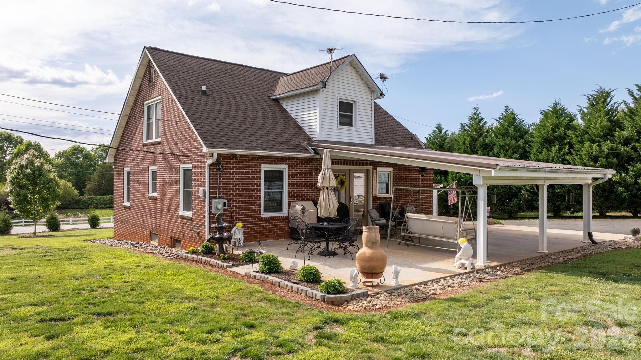 Rest and relax in the back carport which overlooks this beautiful land. - None, Newton