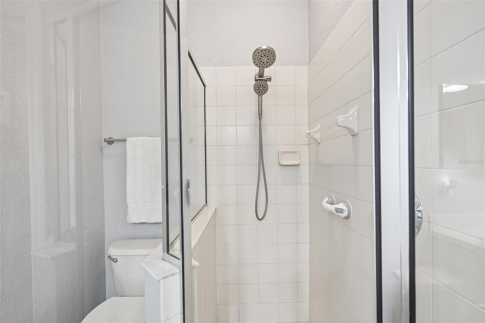 GLASS SHOWER IN PRIMARY BATHROOM - 1003 FAIRWAYCOVE LN #201, BRADENTON