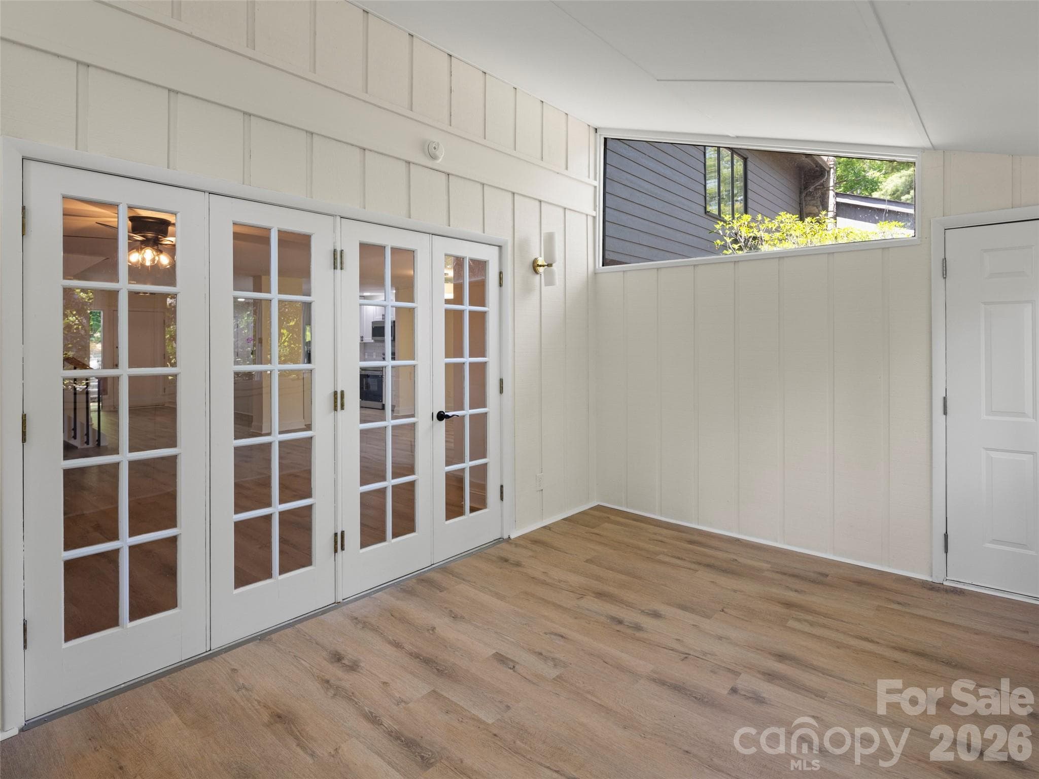 sunroom with french doors to living room - 203 Crowfields Drive, Asheville