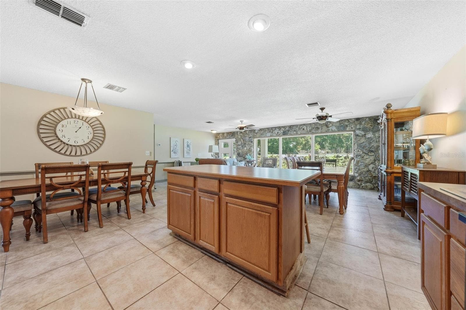 Kitchen looking to the great room and front foyer - 37237 GRAYS AIRPORT RD, LADY LAKE