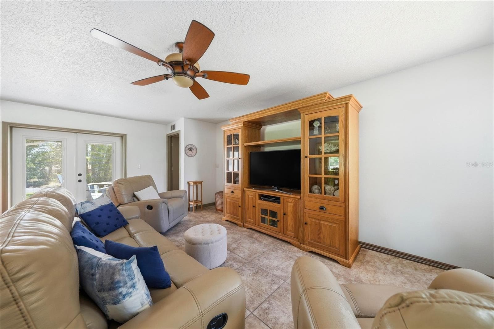 Family room showing French doors to the side patio and Master Bedroom door. - 37237 GRAYS AIRPORT RD, LADY LAKE