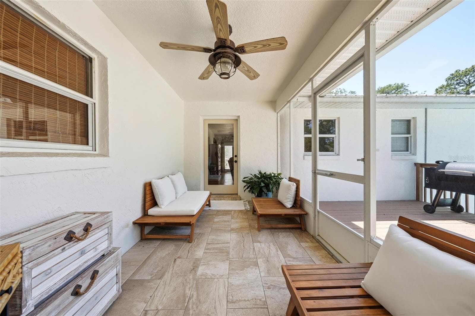 screened back porch with door to the family room - 37237 GRAYS AIRPORT RD, LADY LAKE