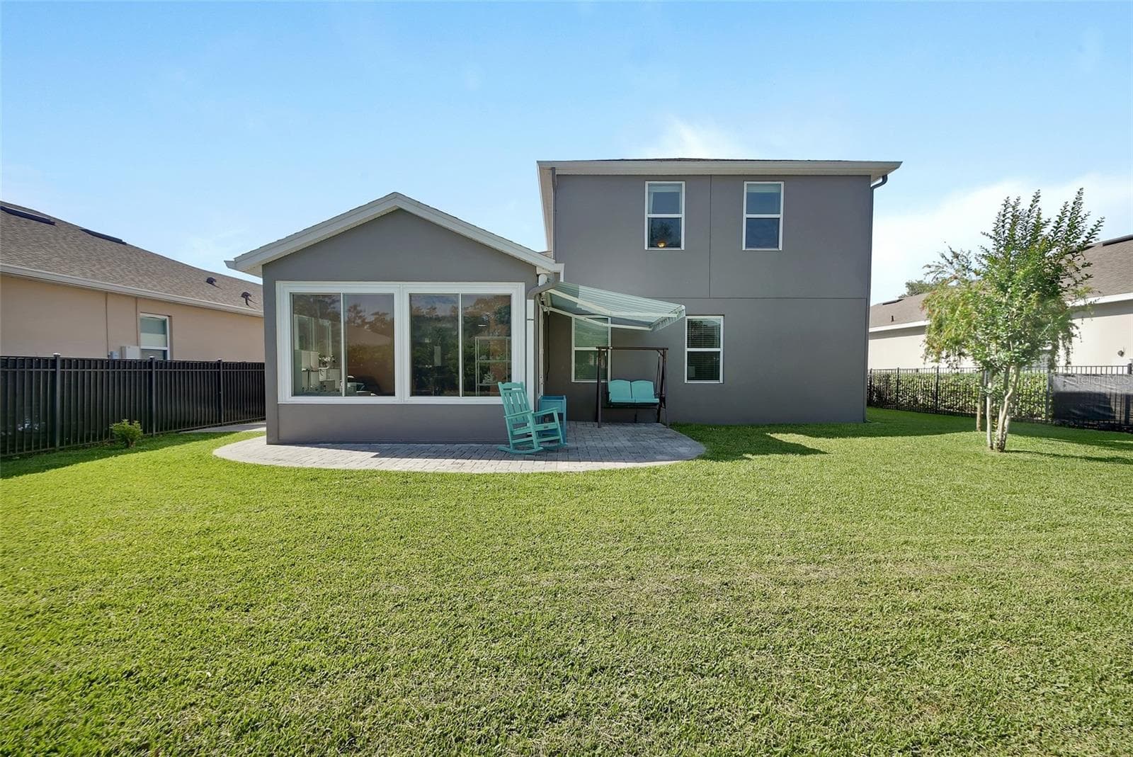 Back of home and paver decks - 337 ORCHARD HILL ST, DELAND