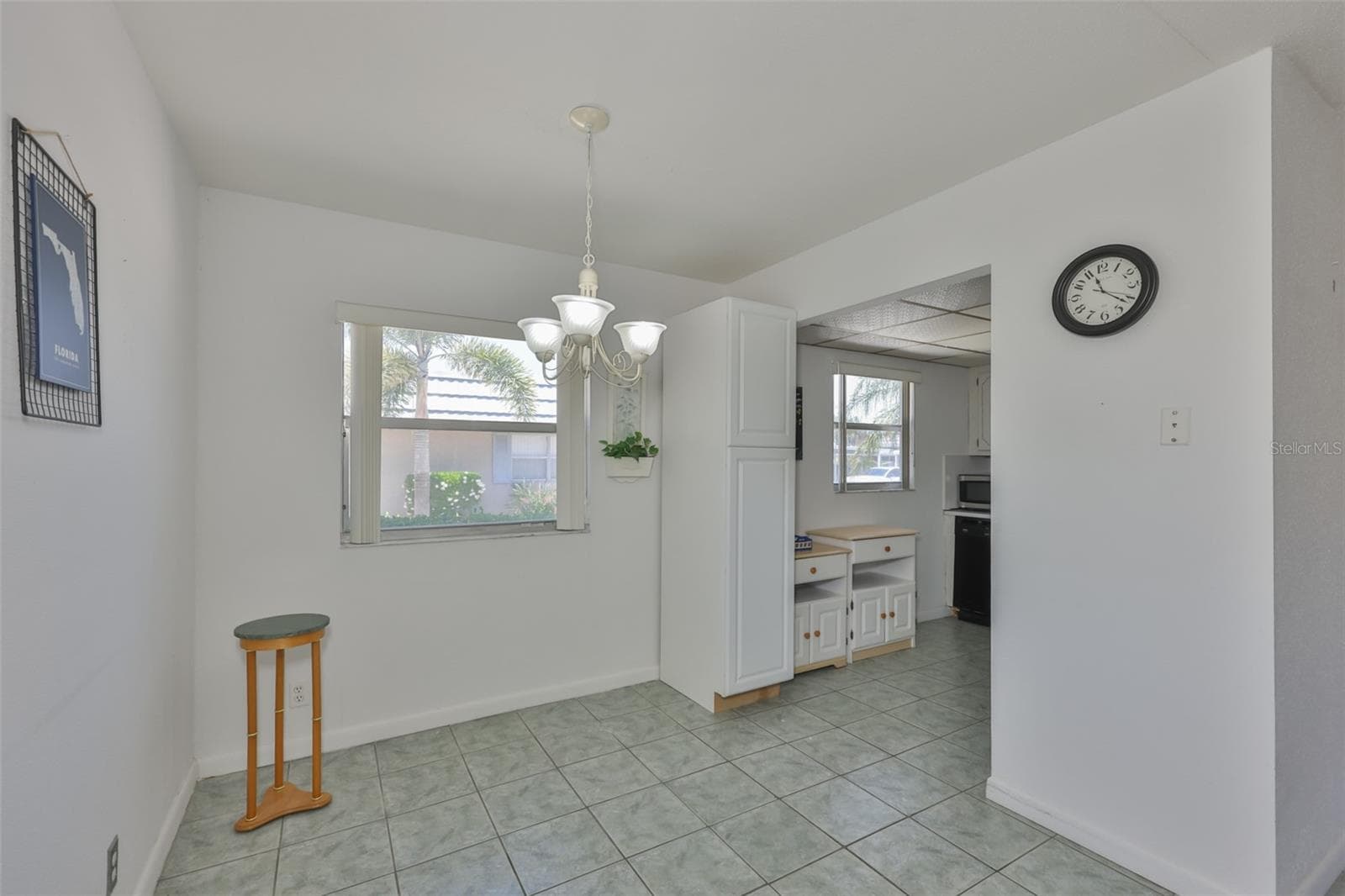 VIEW OF DINING AREA FROM FRONT DOOR. - 1802 BEDFORD TER #177, SUN CITY CENTER
