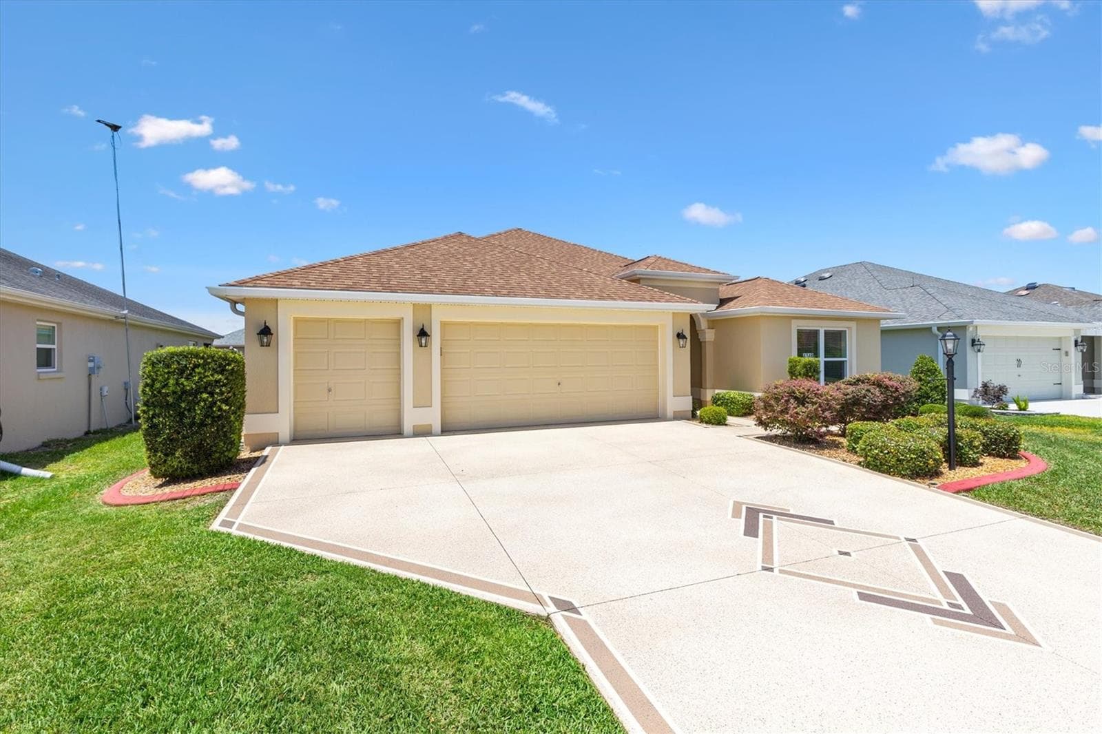 Extended 2 car plus golf cart garage with wide driveway. - 4348 TUSCALOOSA PATH, THE VILLAGES