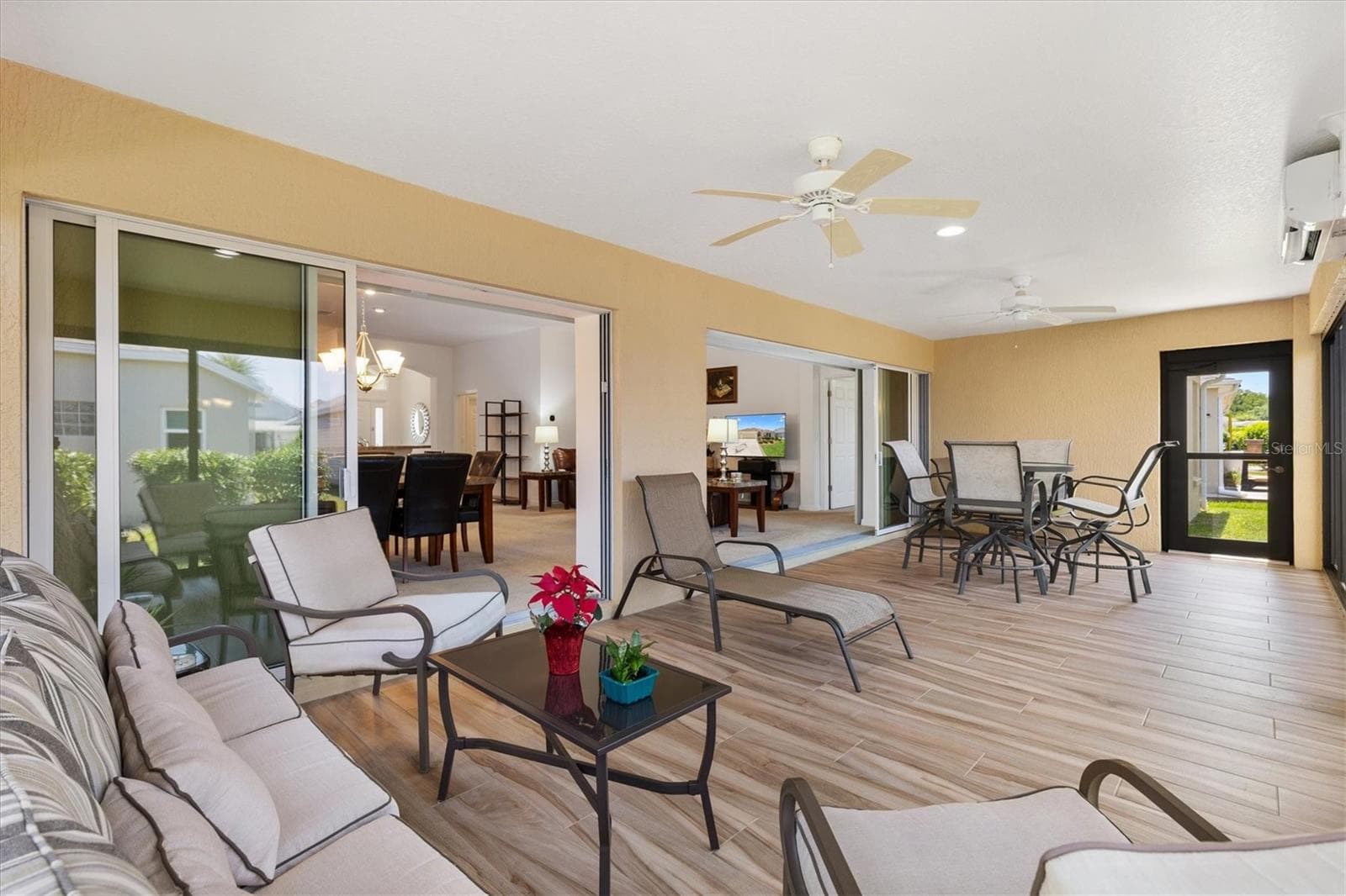 Telescoping sliders open to the lanai. - 4348 TUSCALOOSA PATH, THE VILLAGES