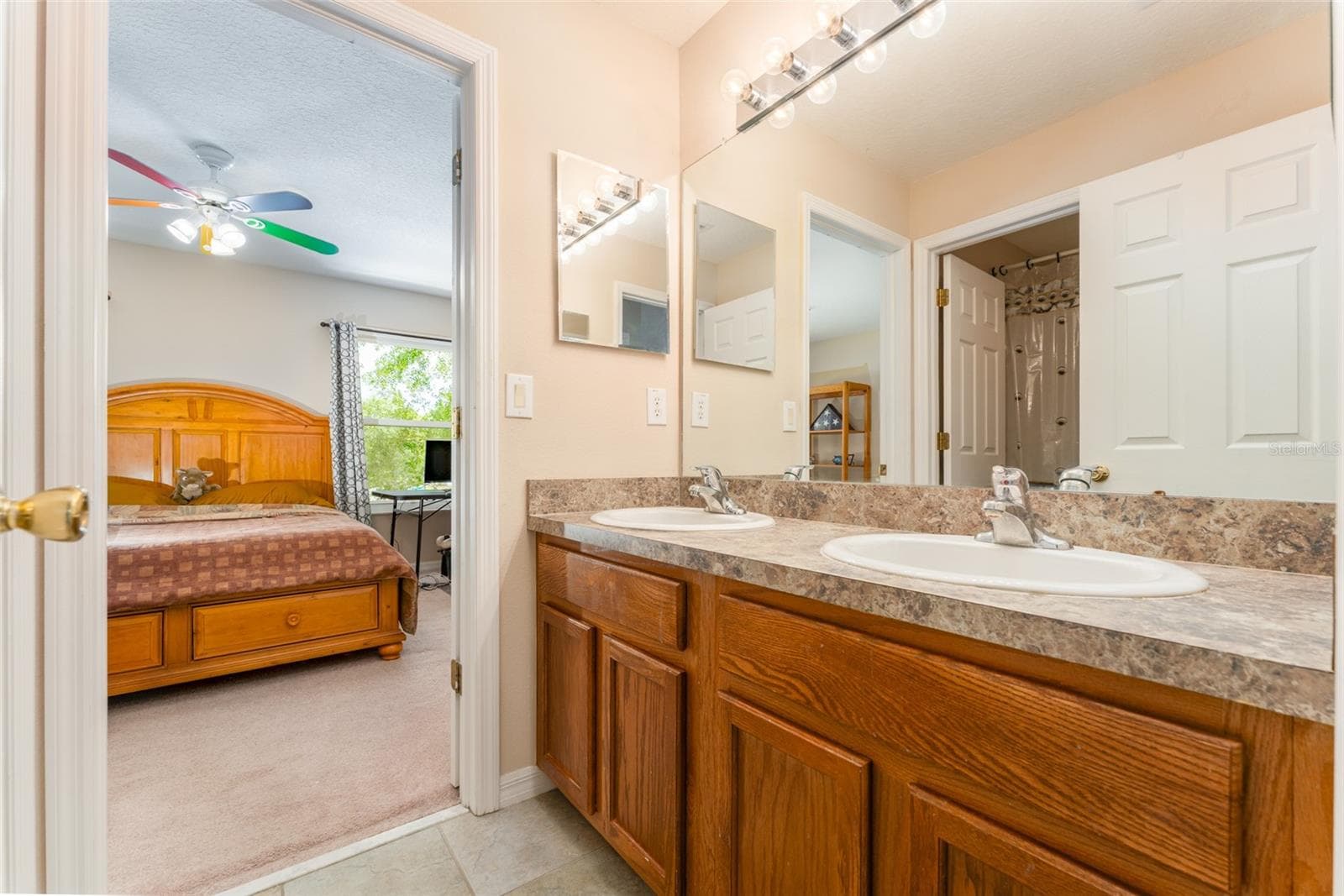 full bath that is attached to bedroom 2 & serves the rest of the upstairs - 6302 BRIDGEVISTA DR, LITHIA