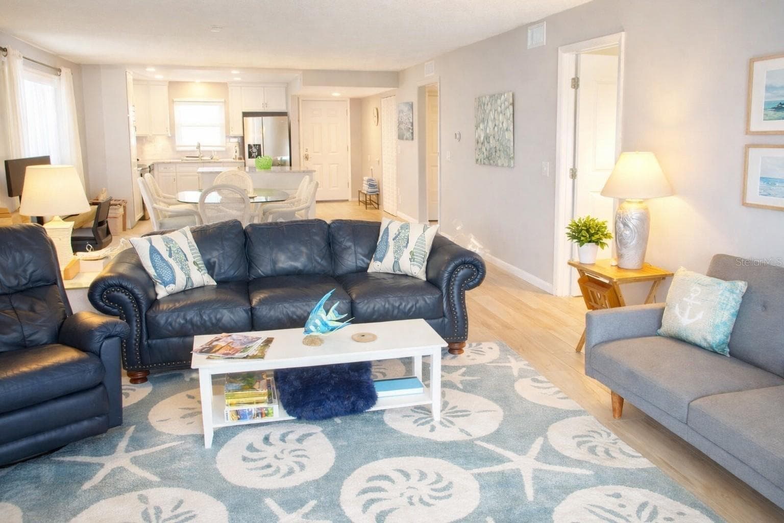 living area. Step inside and feel the openness of 1,250 sq/ft of thoughtfully designed living space. Natural daylight pours through the corner windows - 9825 HARRELL AVE #404, TREASURE ISLAND