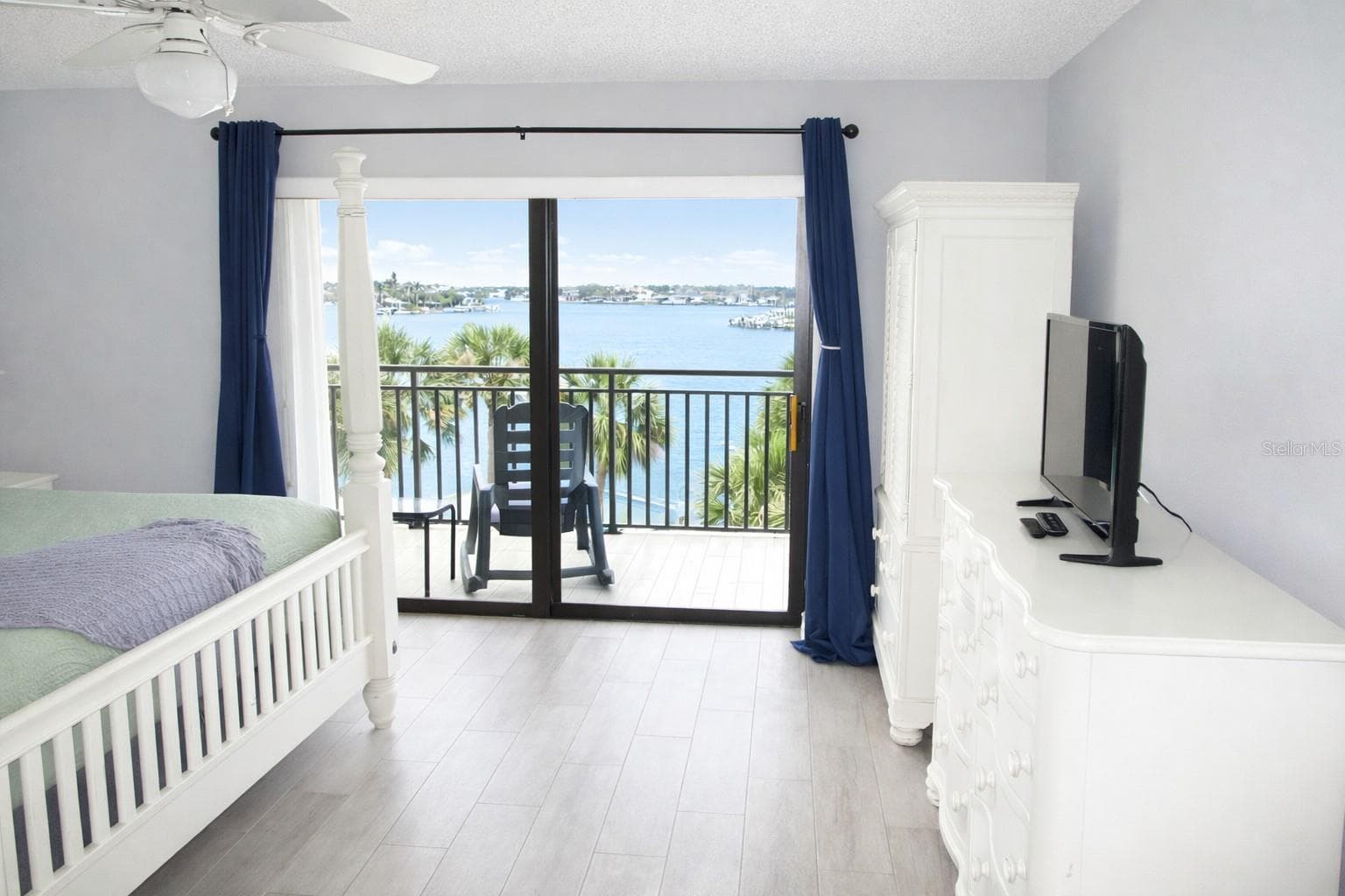 Primary Bedroom with entrance to balcony. - 9825 HARRELL AVE #404, TREASURE ISLAND