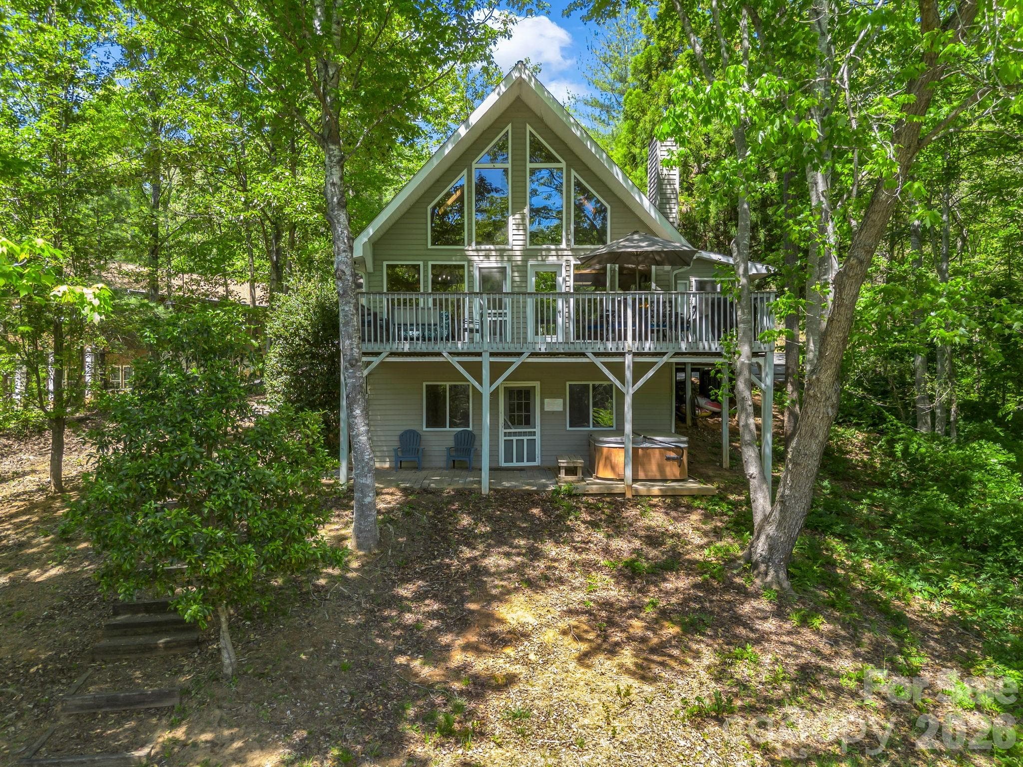 Gentle slope to lake front with shaded home. - 268 Mallard Road, Lake Lure