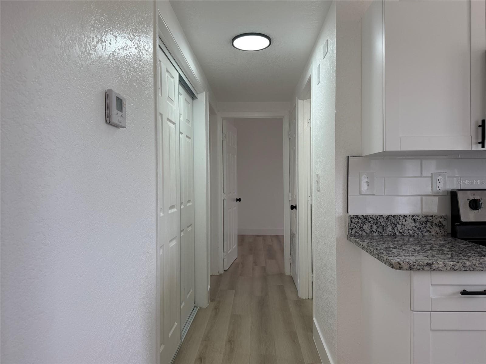 Hall, Laundry Closet to the Left - 514 GREENBROUGH DR, LAKE WALES