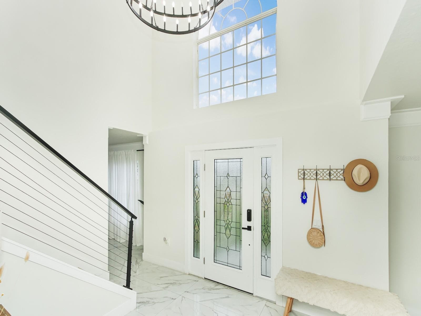 front entrance foyer create an image of adventure into your new home. - 7561 LAKE ANDREA CIR, MOUNT DORA