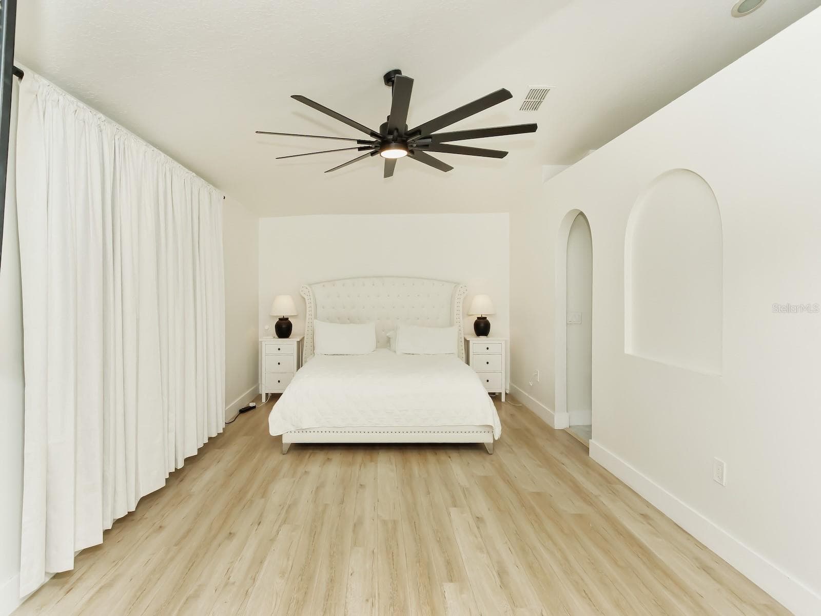 The Master Suite is the most luxurious of all, with 3 walkin Master closets and a fan to make the room cozy and perfect for a great night sleep - 7561 LAKE ANDREA CIR, MOUNT DORA