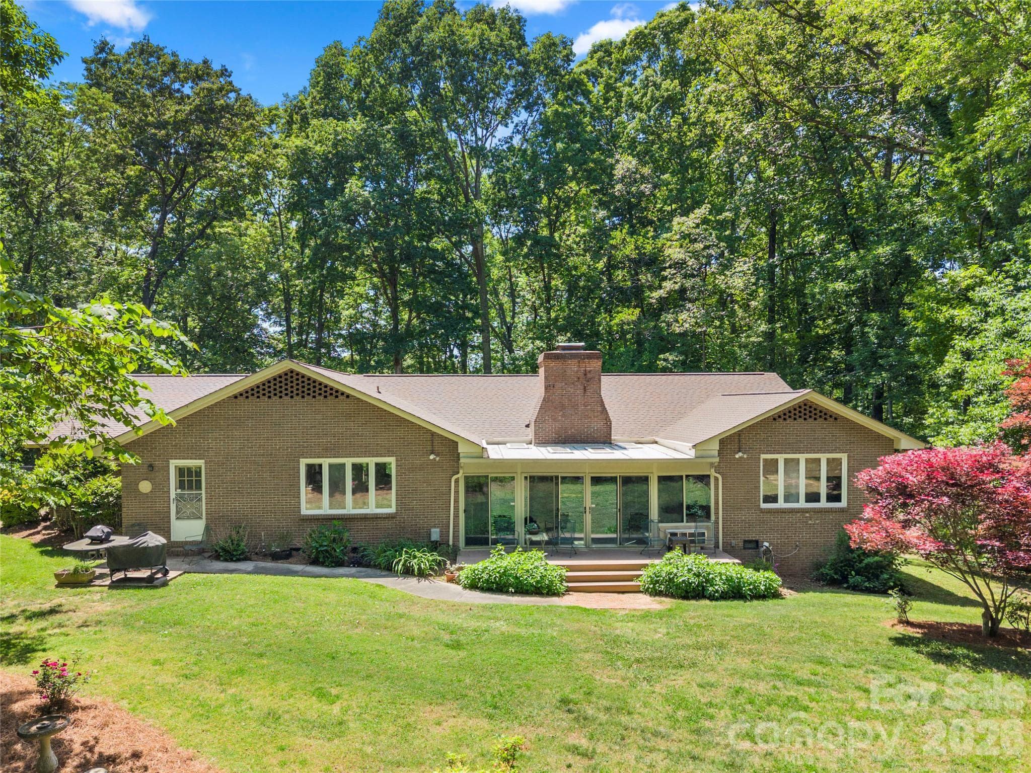 Rear of home/backyard - property is completely surrounded by trees - Gastonia
