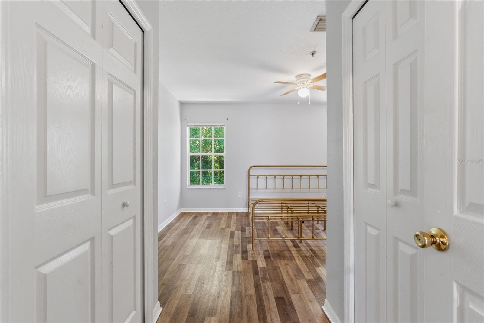 His & hers closets leading into primary bedroom - 2049 FIESTA RIDGE CT, TAMPA