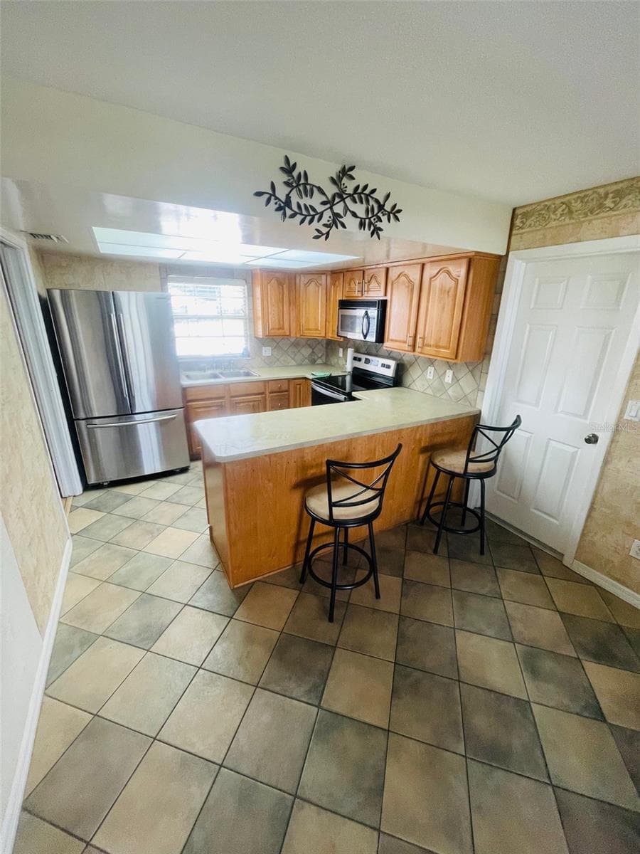 Kitchen view from Diningroom - 999 ELEANOR AVE, DELTONA
